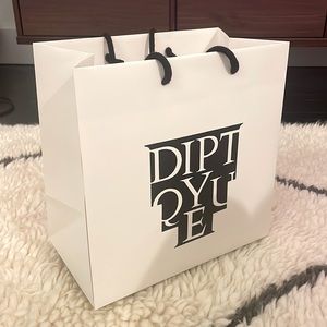 Large empty Diptqyue paper shopping bag